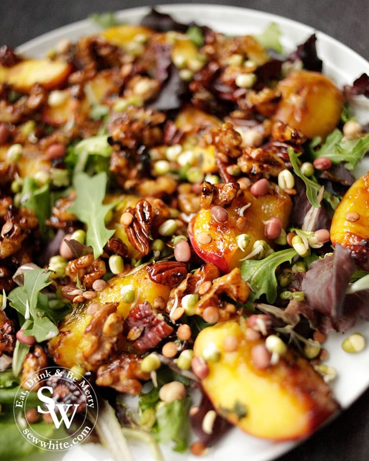 A beautiful Maple Syrup Grilled Peach and Nut Salad. Filled with earthy green leaves, rich and warming caramelised fruit.